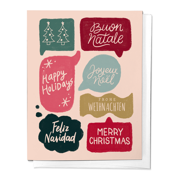 A set of folded Christmas greeting cards with various holiday greetings in different languages, featuring a Christmas tree and holiday decorations, printed on white card stock.