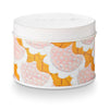 A white tin candle with a pattern of pink and orange flowers on the lid.