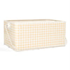 A beige gingham tin utensil caddy with a checkered pattern and a collapsible handle.