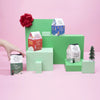 Collection of Big Heart Teas packaging on a pink background