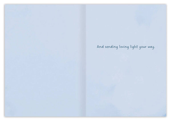 Open book with a light blue cover displaying text on a white background