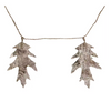 Decorative leaf garland with a twig-like structure on a white background