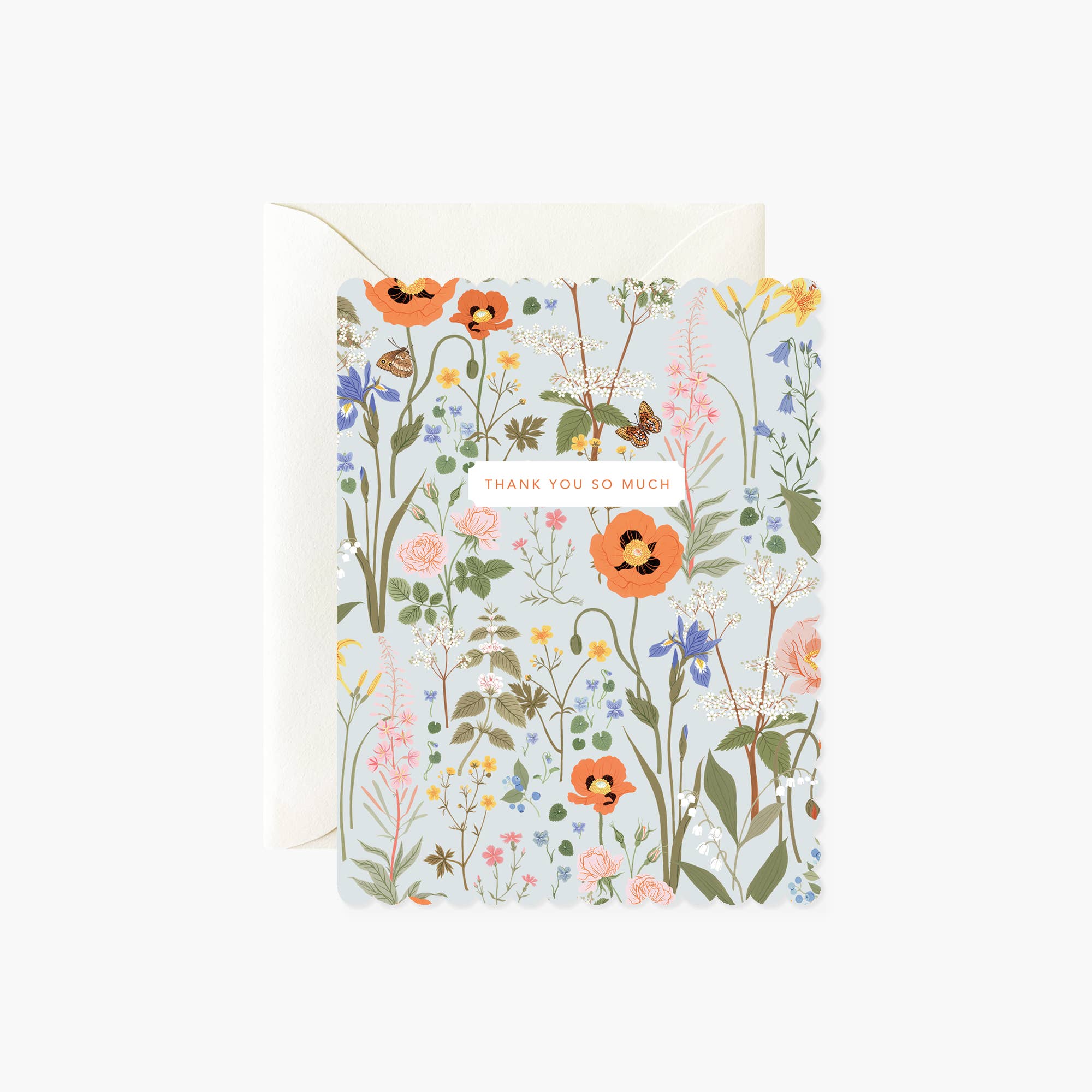 A folded thank you card with a floral design, heavy card stock, and scalloped die-cut edges.