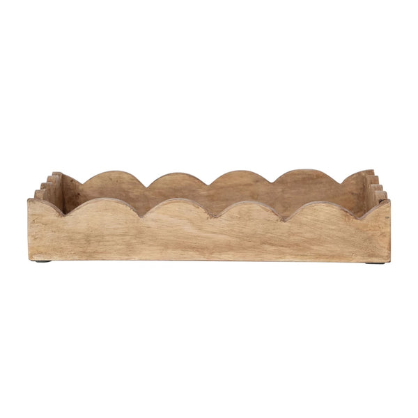 A rectangular mango wood scalloped tray with a natural finish.