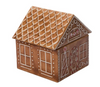 A ceramic cookie jar shaped like a gingerbread house with orange brown color, white lining, and red accents.