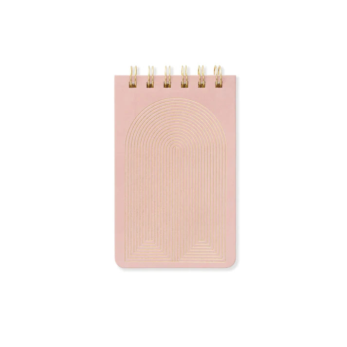 Pink notebook with gold arch design on a white background