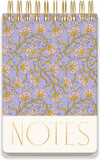 Notebook with floral pattern and 'NOTES' text on a purple background