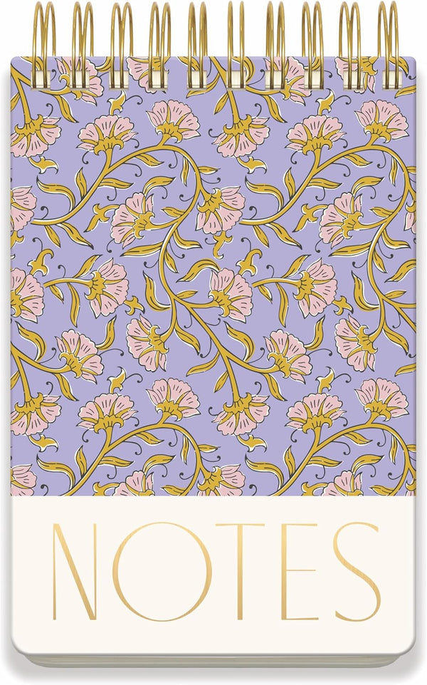 Notebook with floral pattern and 'NOTES' text on a purple background