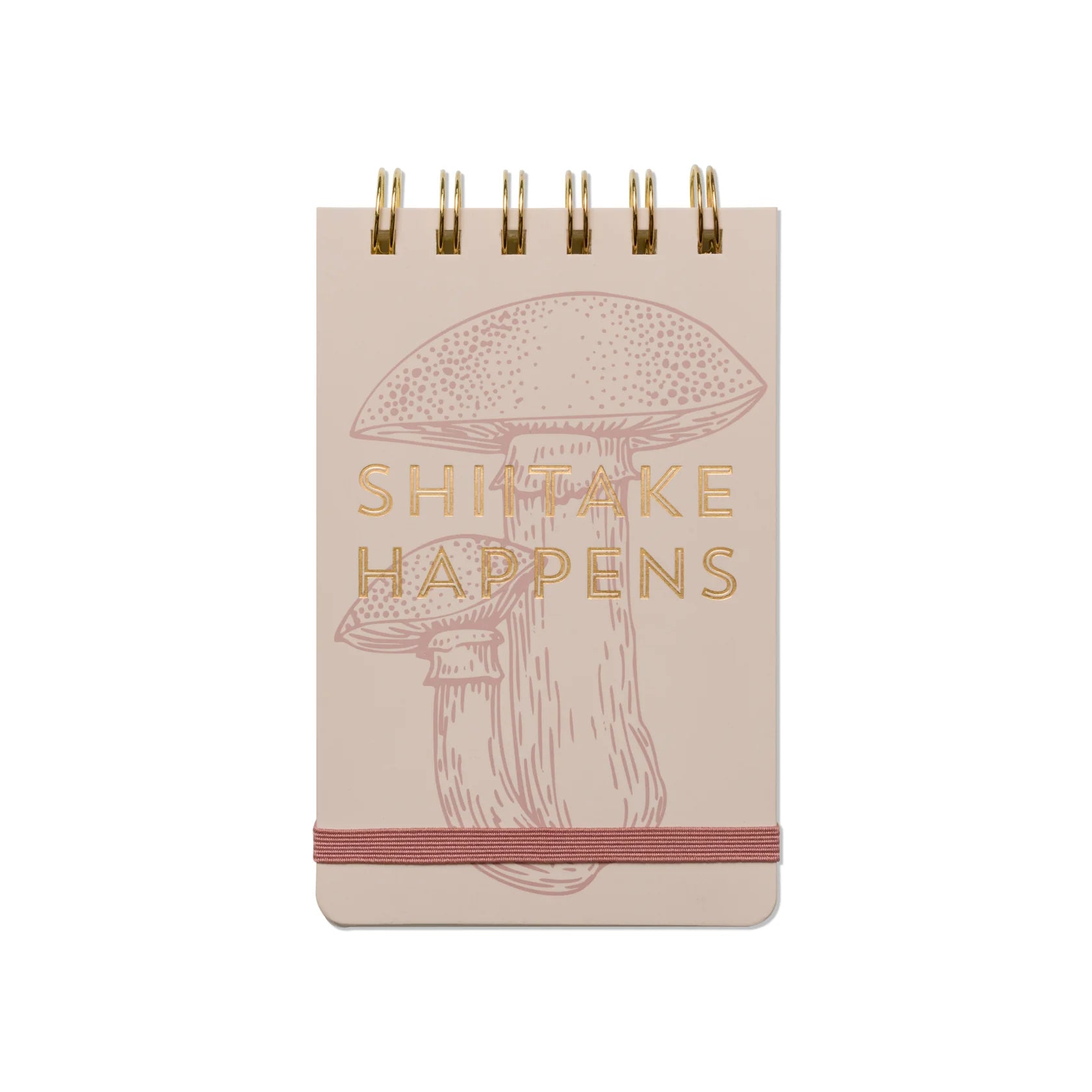 Notebook with mushroom illustration and 'Shitake Happens' text on a beige background