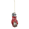 A red glass golf bag ornament with glitter, hanging from a gold-colored chain.