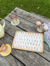 Wooden tray with ice cream pattern on a wooden table outdoors