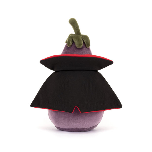 Plush toy shaped like an eggplant with a black cape on a white background
