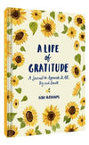 A cover image of 'A Life of Gratitude' journal by Lori Roberts featuring a floral pattern with sunflowers and the title displayed prominently.
