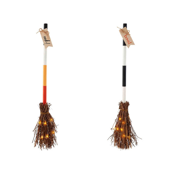 Two broom-shaped light-up Halloween decor items with multicolored handles and brown bristles, with string lights on the bristles.