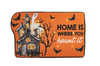 Halloween-themed decorative mat with haunted house and text on an orange background