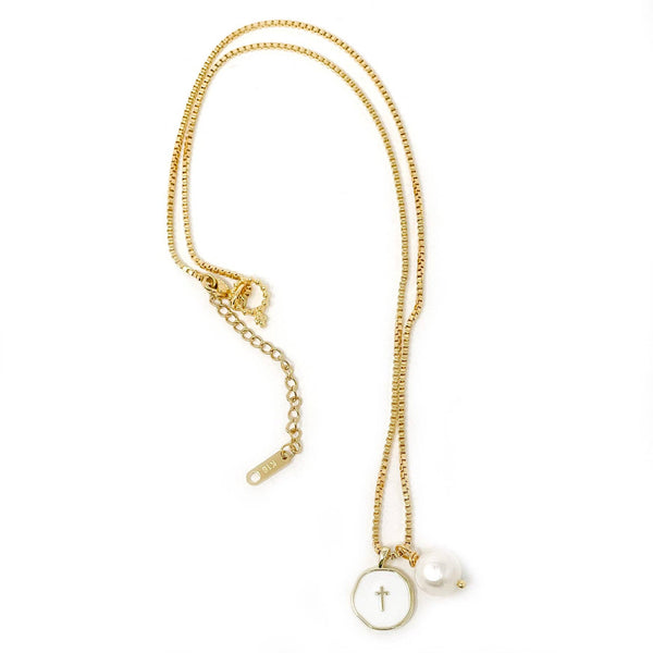 Gold necklace with a cross pendant on a white background