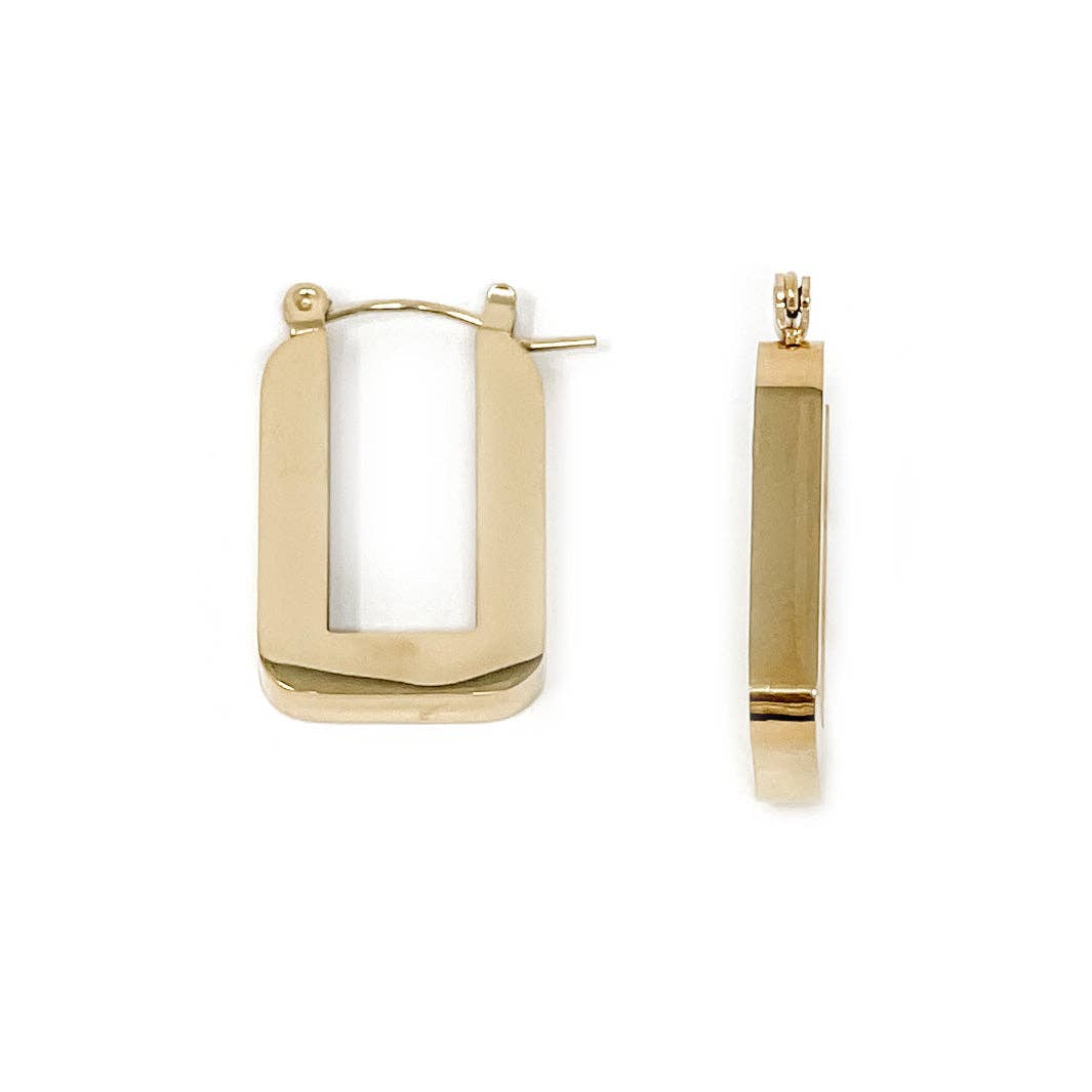 Gold hoop earrings on a white background