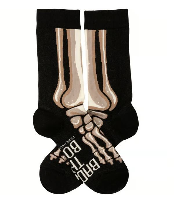 Black socks with skeleton design and text on a white background