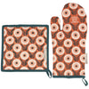 Floral patterned pot holder and oven mitt on a white background