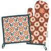Floral patterned pot holder and oven mitt on a white background