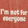 Red cap with white embroidered text 'I'm not for everyone' on a red background