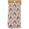 Folded fabric with a floral pattern on a cardboard backing