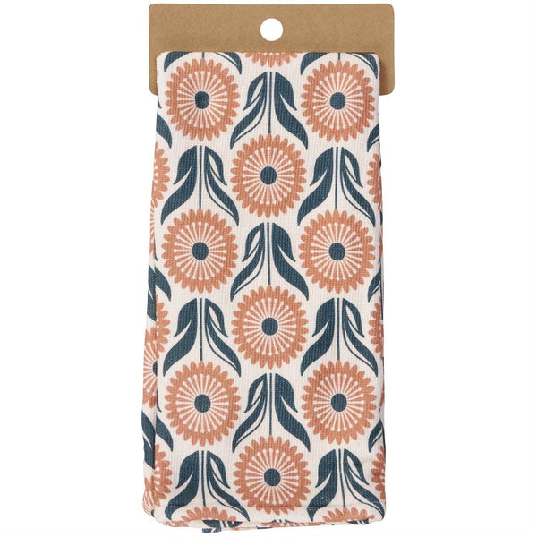 Folded fabric with a floral pattern on a cardboard backing