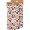 Floral patterned kitchen towel with packaging on a white background