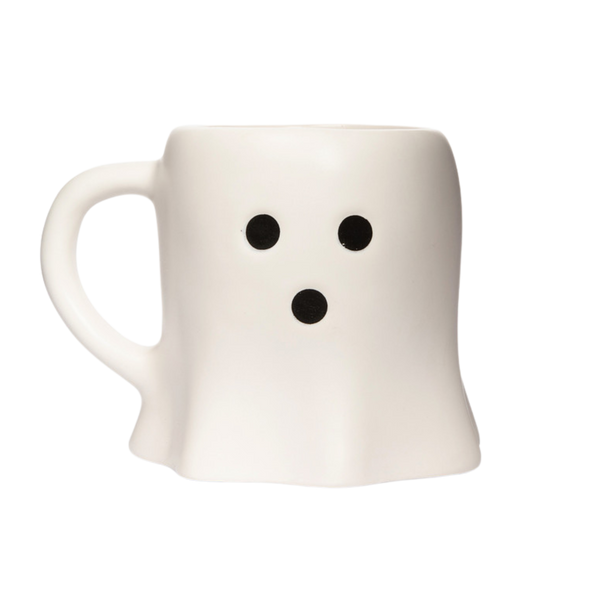 White mug with black dot eyes and mouth on a white background