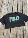 Black t-shirt with 'PHILLY' printed in green on a wooden surface