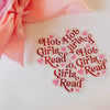 Sticker with 'Hot Girls Read' text on a white background