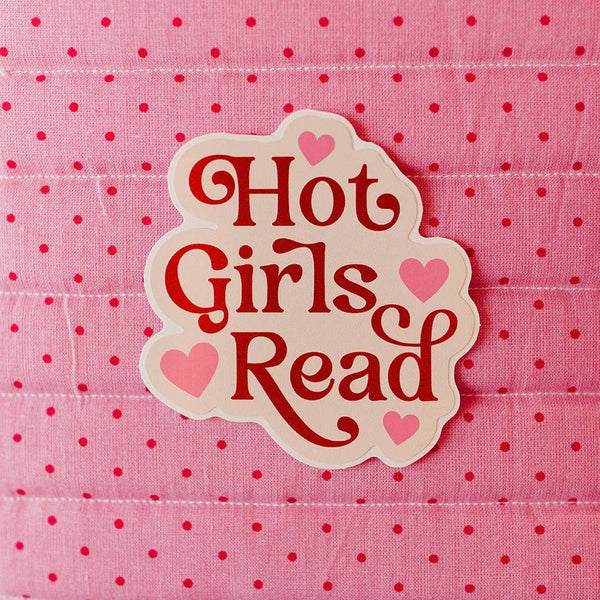 Decorative sticker with 'Hot Girls Read' text on a pink polka dot background