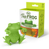 A green silicone tea infuser designed to look like a frog, displayed alongside its packaging.