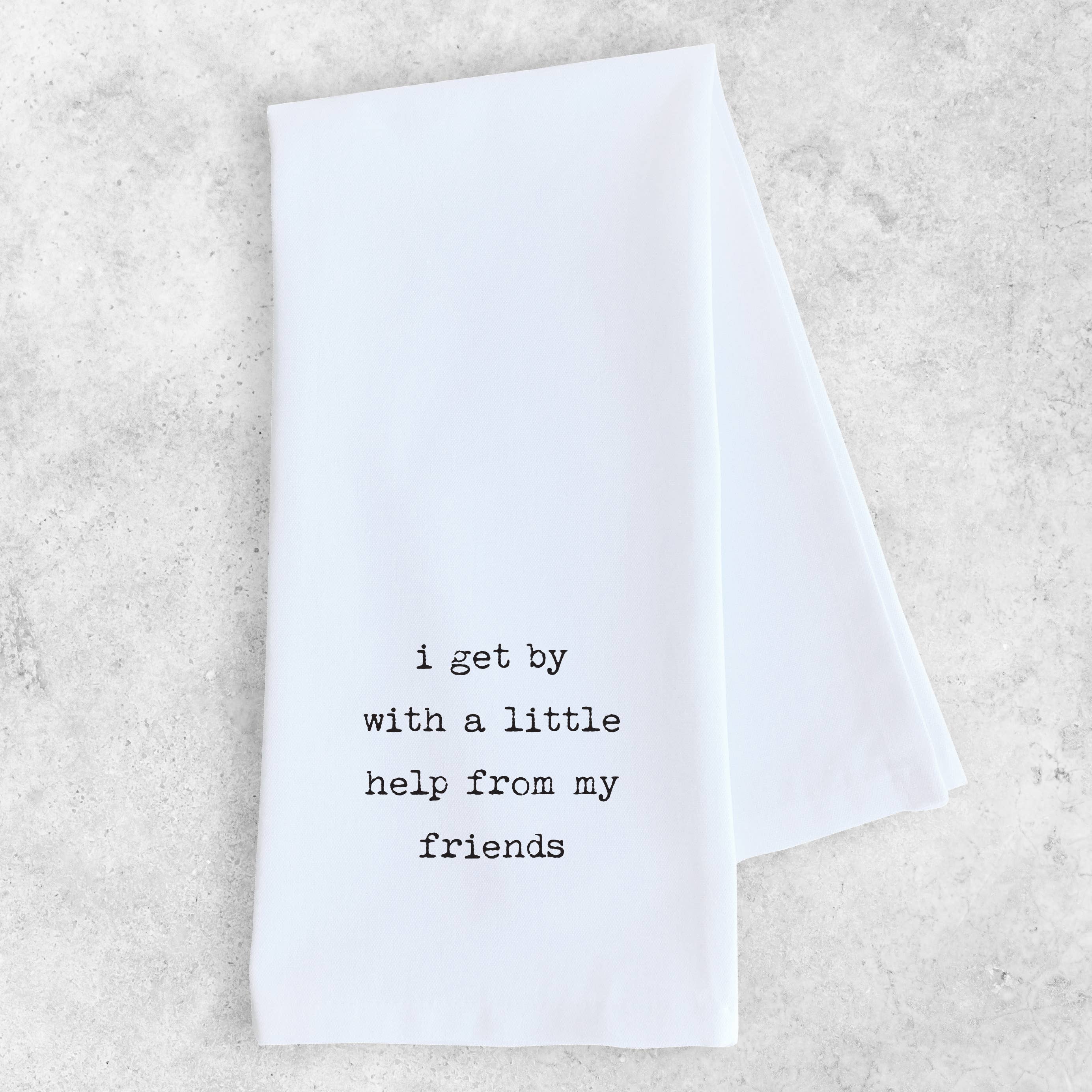 White towel with black text on a light gray background