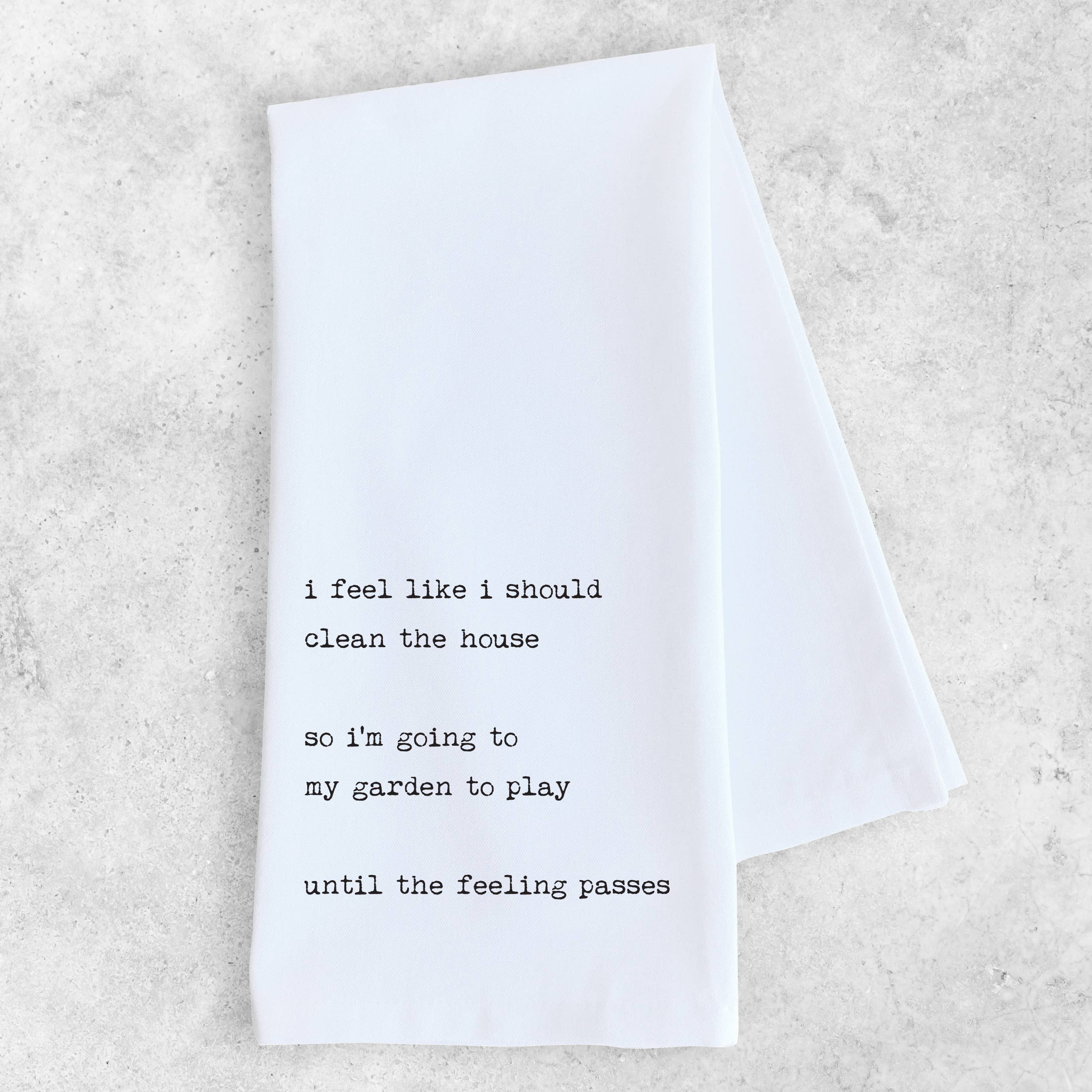 White towel with black text on a light gray background