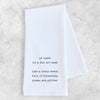 White towel with black text on a light gray background