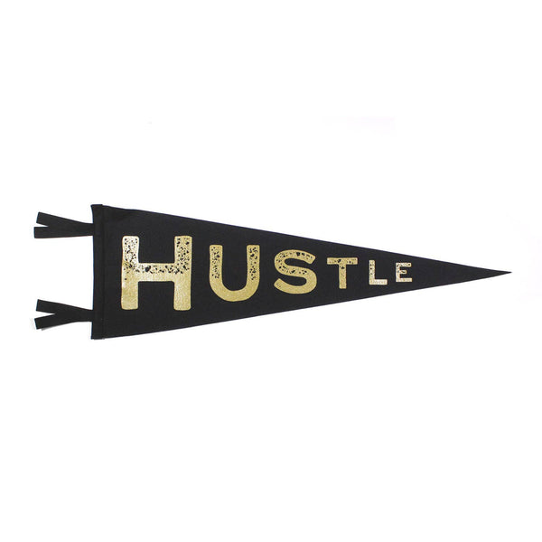 A black and gold pennant with the word 'HUSTLE' printed in gold lettering.