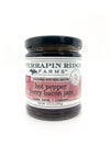 A jar of Terrapin Ridge Farms Hot Pepper Berry Bacon Jam with label showing the product name and bacon image, on a white background.