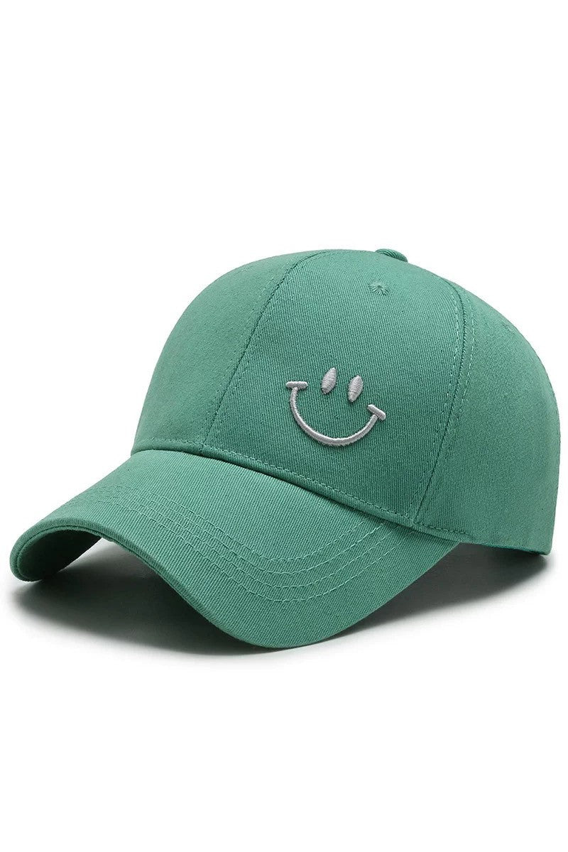 Green smiley face embroidered backward baseball cap