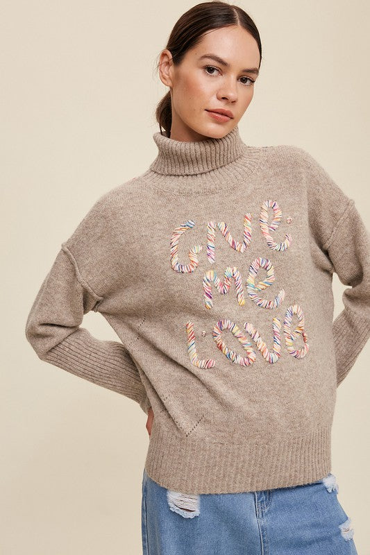 GIVE ME LOVE STITCHED MOCK NECK SWEATER