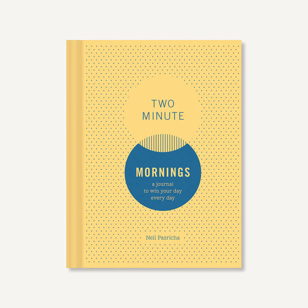 Journal titled 'Two Minute Mornings' with a yellow cover and blue circle on a white background