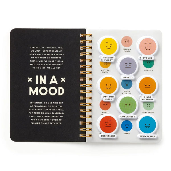 Emoticon sticker set with a black notebook on a white background