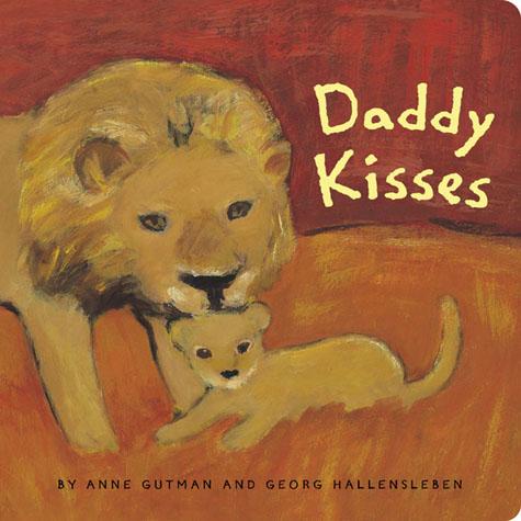 Book cover of 'Daddy Kisses' with a lion and cub illustration on a red background