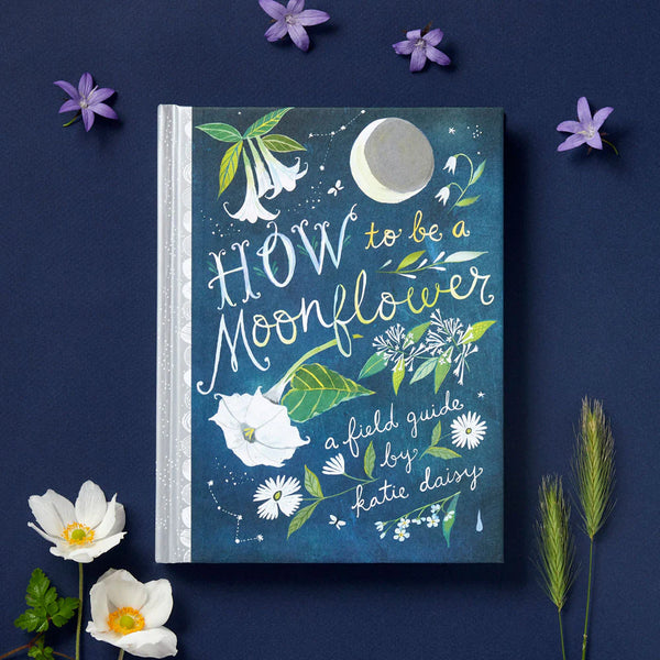 Book titled 'How to be a Moonflower' with floral illustrations on a dark blue background