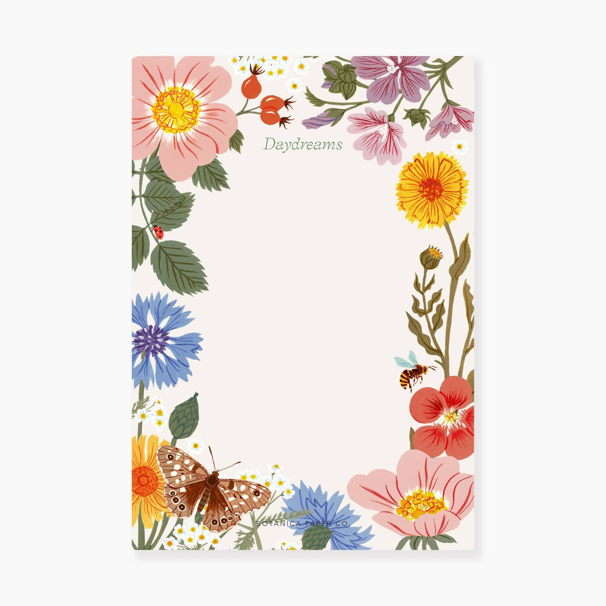 A notepad with a floral pattern including flowers in various colors and a butterfly, with the word 'Daydreams' written at the top.
