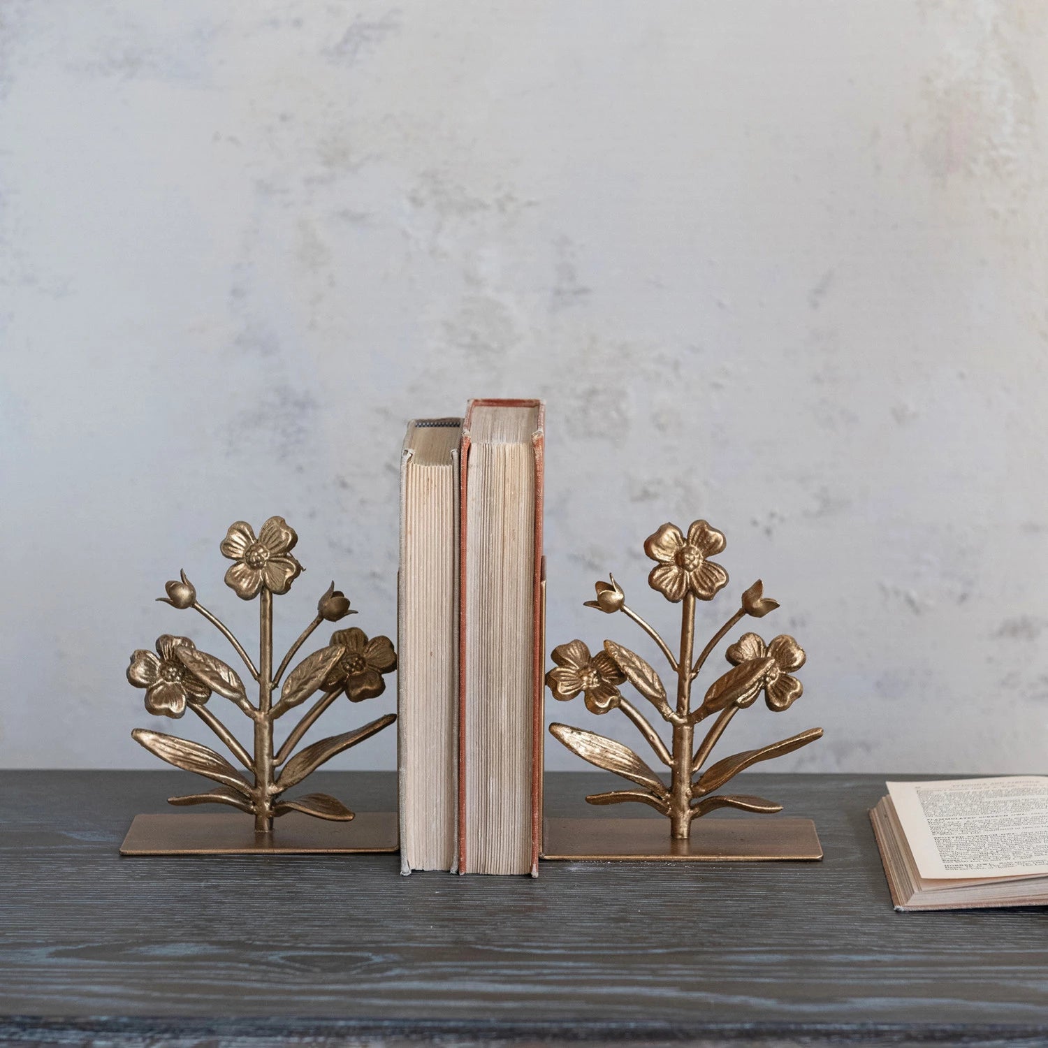 SINGLE CAST IRON FLOWER SHAPED BOOKEND, GOLD