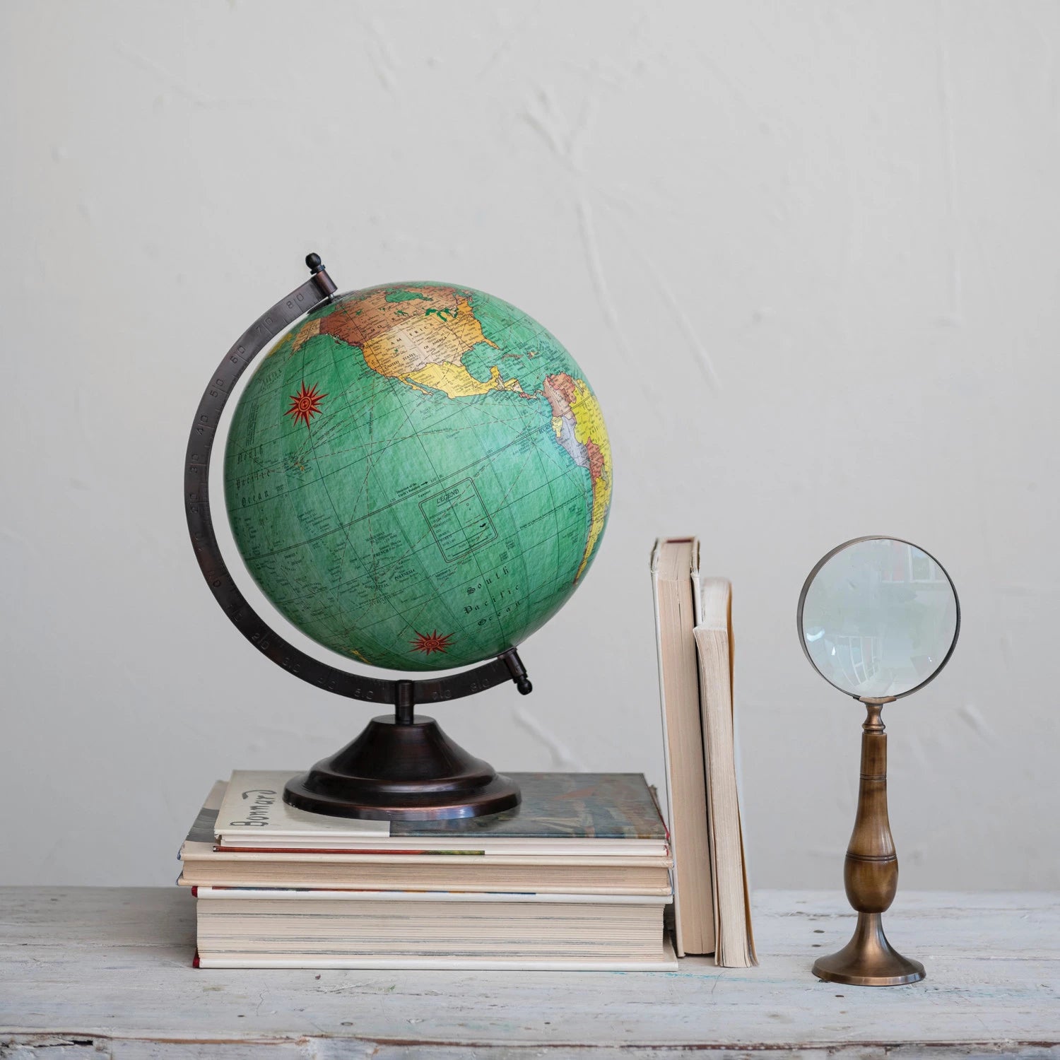 BRASS & BONE MAGNIFYING GLASS ON STAND, ANTIQUE FINISH