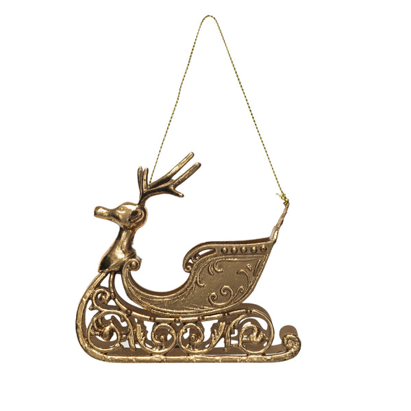 Gold plastic sleigh ornament with a reindeer design, hanging from a chain.