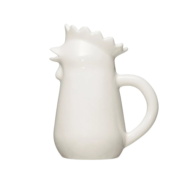 A white stoneware creamer pitcher designed to resemble a chicken.