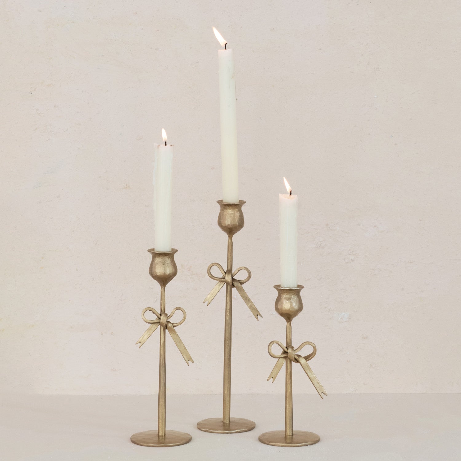 HAND-FORGED IRON TAPER HOLDERS W/ BOW, ANTIQUE GOLD FINISH